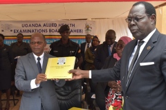 Minister of State for Higher Education Hon.J.C.Muyingowith UAHEB Chairman Board Mr. Ayisu Stephen Officiating release of 2018 2019 Examinations results at UAHEB Offices Kyambogo